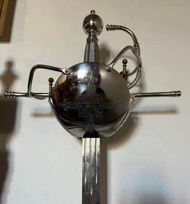 a metal object is hanging on a wall at La Halte Louis XIII in Bram