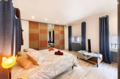 a living room with a couch and a table at Le Barral in Castres