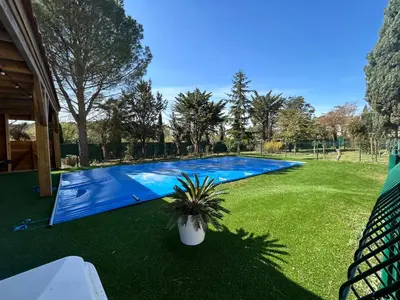 a swimming pool in the middle of a yard at VILLA AU CALME AVEC PISCINE in Moussan