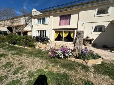 a house with flowers in front of it at VILLA AU CALME AVEC PISCINE in Moussan