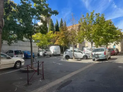 a bunch of cars parked in a parking lot at jouxtant le canal du midi in Trèbes