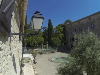 a street light on the side of a building at Castel chambres in Malves-en-Minervois