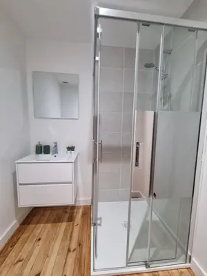 a shower stall in a bathroom with a sink at Maison cosy rénovée, proche de Carcassonne in Villarzel-Cabardès