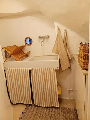 a bathroom with a sink in a small room at La Petite Romance - Gîte 3 étoiles in Siran