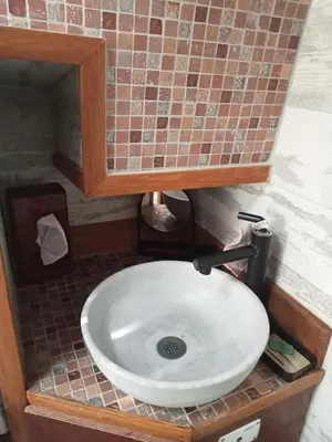 a sink in a bathroom with a counter top at Bateau de pirates in Gruissan