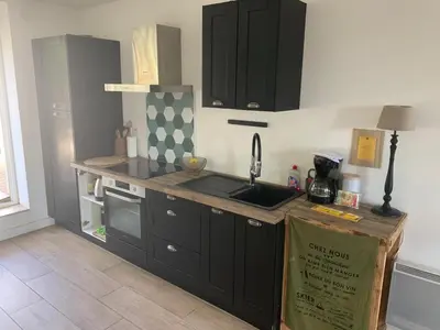 a kitchen with a sink and a counter top at La maison de Marie - Jardin arboré - Garage privatif - Netflix in Carcassonne