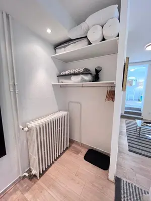 a walk in closet with a radiator and plates at Salut Le Petit Gite in Carcassonne