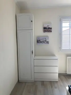 a white room with a white door and a window at Villa Reine du Sud proche des Grands Buffets in Narbonne