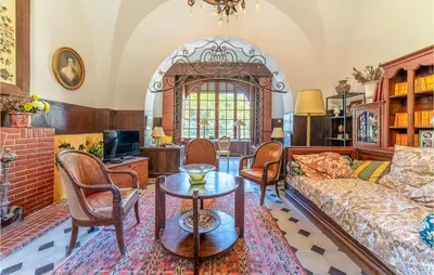 a living room with a couch and chairs at Amazing Home In Lézignan-Corbières in Lézignan-Corbières