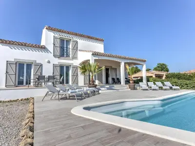 a villa with a swimming pool and a patio at Luna in Aigne