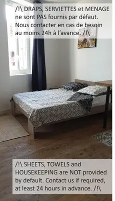 a poster of a bed in a room at Appartements simples et fonctionnels in Pamiers