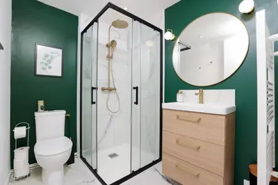 a bathroom with a toilet and a sink and a mirror at Le T2 Chic ! in Carcassonne