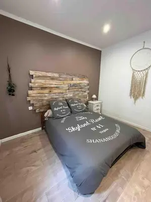 a bedroom with a large bed in a room at Les Suites du Palais in Carcassonne