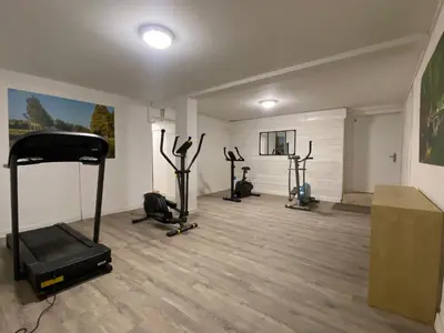 a gym with several exercise bikes in a room at Maison indépendante, canal du Midi, Piscine in Homps