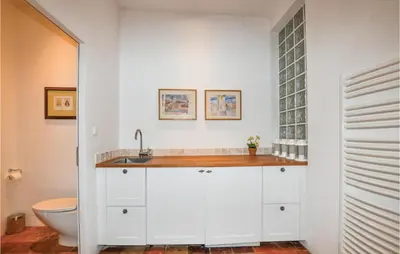 a bathroom with a sink and a toilet at Amazing Home In Thézan-Des-Corbières in Thézan-des-Corbières