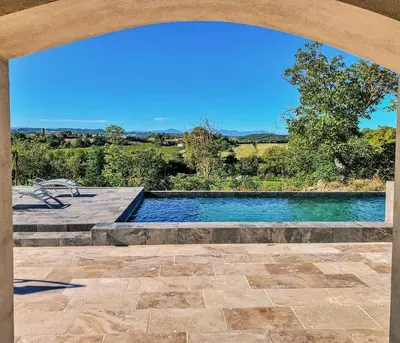 a swimming pool in the middle of a patio at Pax et Amor Chambres d'hôtes de charme - Charming B&B in Mazerolles-du-Razès