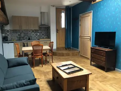 a living room with a couch and a table at Pax et Amor Chambres d'hôtes de charme - Charming B&B in Mazerolles-du-Razès