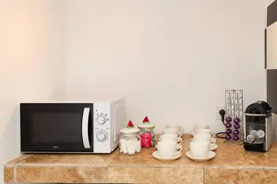 a microwave sitting on top of a counter at Les Remparts in Carcassonne