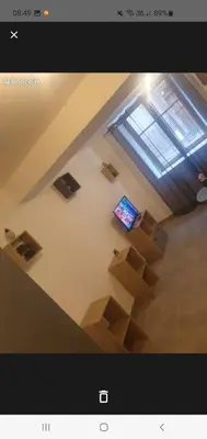 a view of a staircase with a television in a room at Jolie T2 en rez de chaussée in Carcassonne