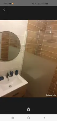 a picture of a room with a mirror and a curtain at Jolie T2 en rez de chaussée in Carcassonne