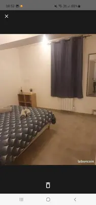 a picture of a bed in a room at Jolie T2 en rez de chaussée in Carcassonne