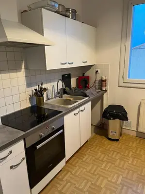 a kitchen with a sink and a counter top at Appartement 2 chambres narbonne in Narbonne