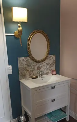 a bathroom with a sink and a mirror at Mas des 2 paons in Villedaigne