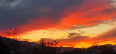 a sunset over the mountains with a red sky at Trois appartements au sein du Mas Jams - Le Gouleyrous, Le Canigou et Le Figarassa in Vingrau