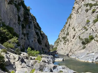 a river cuts through a rocky canyon at Trois appartements au sein du Mas Jams - Le Gouleyrous, Le Canigou et Le Figarassa in Vingrau
