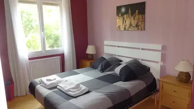 a bedroom with a bed with two towels on it at Ty Calon Lan in Montazels