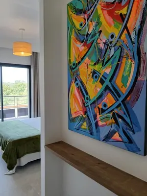 a bedroom with a large bed with pillows and a window at Villa st Francois Heated swimming pool ,air conditioning ,free parking in Carcassonne