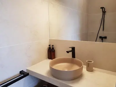 a shower with a shower head in a bathroom at Villa st Francois Heated swimming pool ,air conditioning ,free parking in Carcassonne