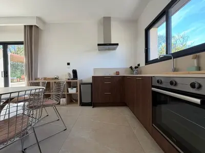 a bedroom with a bed with pillows on it at Villa st Francois Heated swimming pool ,air conditioning ,free parking in Carcassonne
