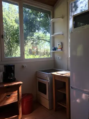a kitchen with a stove and a window at Château Pech-Celeyran in Salles-dʼAude