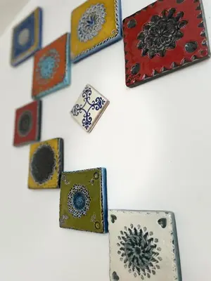 a group of different types of cards on a wall at Le Taurillou in Taurize