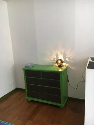 a green dresser with a light on top of it at Escale à Castelnaudary in Castelnaudary