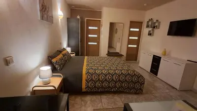 a hotel room with a bed and a table at My Quiet Place near Carcassonne in Carcassonne