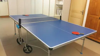 a blue ping pong table in a kitchen at My Quiet Place near Carcassonne in Carcassonne