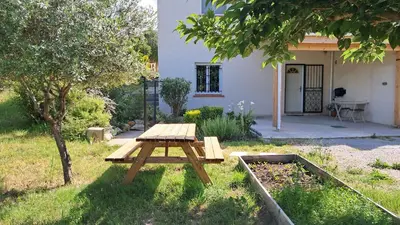 a picnic table in the yard of a house at My Quiet Place near Carcassonne in Carcassonne