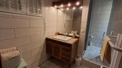 a bathroom with a sink and a shower at My Quiet Place near Carcassonne in Carcassonne
