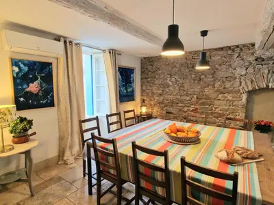 a dining room with a table with fruit on it at L'Orée de la cité in Carcassonne