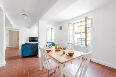a kitchen and dining room with a table and chairs at Les Colonnes - T3 - Bastide in Carcassonne