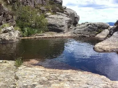 a river with some rocks and some water at Gite été in Le Soulié