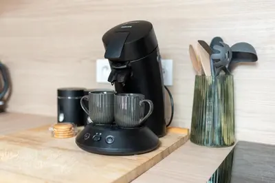 a black coffee maker sitting on a counter at Le Blackwood in Mazamet