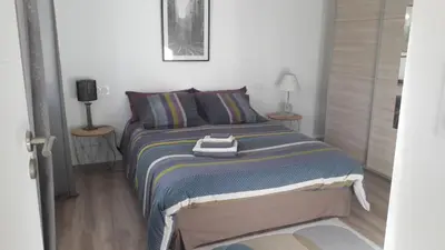 a bedroom with a bed with a towel on it at L' Abri du Saule in Aussillon
