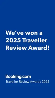 a blue sign that says weve won a traveler review award at Cosy Chalet au cœur du Sidobre avec Piscine et Spa in Vabre