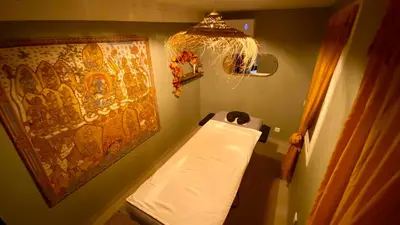 a bathroom with a white toilet in a room at L'annexe spa du Tropical Lodge in Narbonne