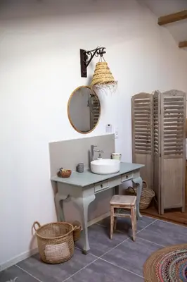 a bathroom with a sink and a mirror at Bessire Chambres & table d'hôtes in Belflou