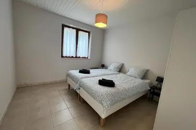 a bedroom with two beds and a window at Le Villerouge - 14 Personnes - Piscine in Fabrezan