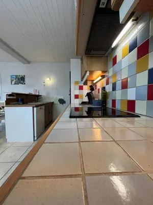 a kitchen with colorful tiles on the wall at Le Villerouge - 14 Personnes - Piscine in Fabrezan